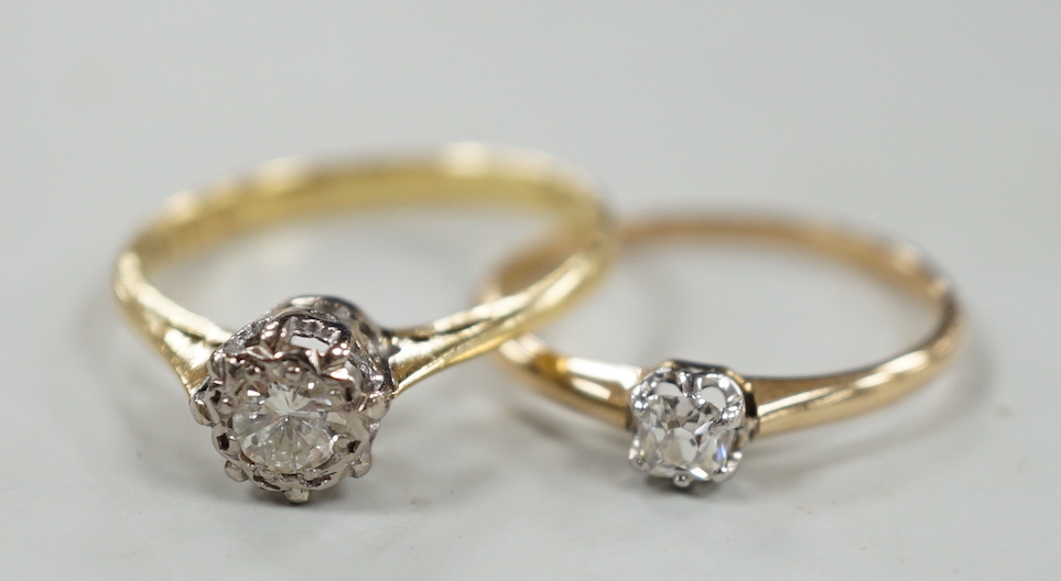 A modern 18ct gold and illusion set solitaire diamond ring, size N and one other smaller 18ct and solitaire diamond ring, gross weight 3.7 grams.